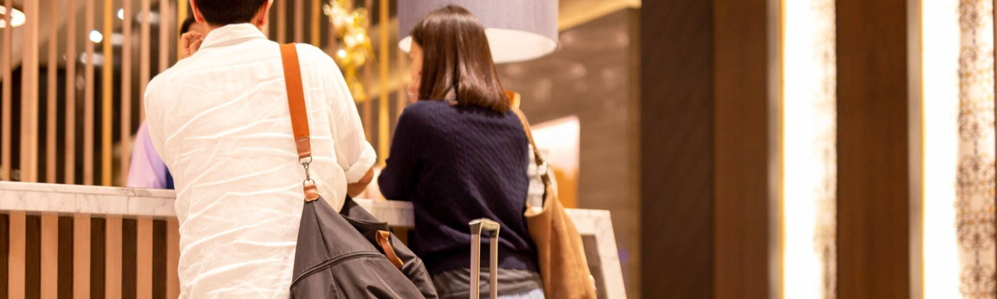 couple checking in at hotel reception